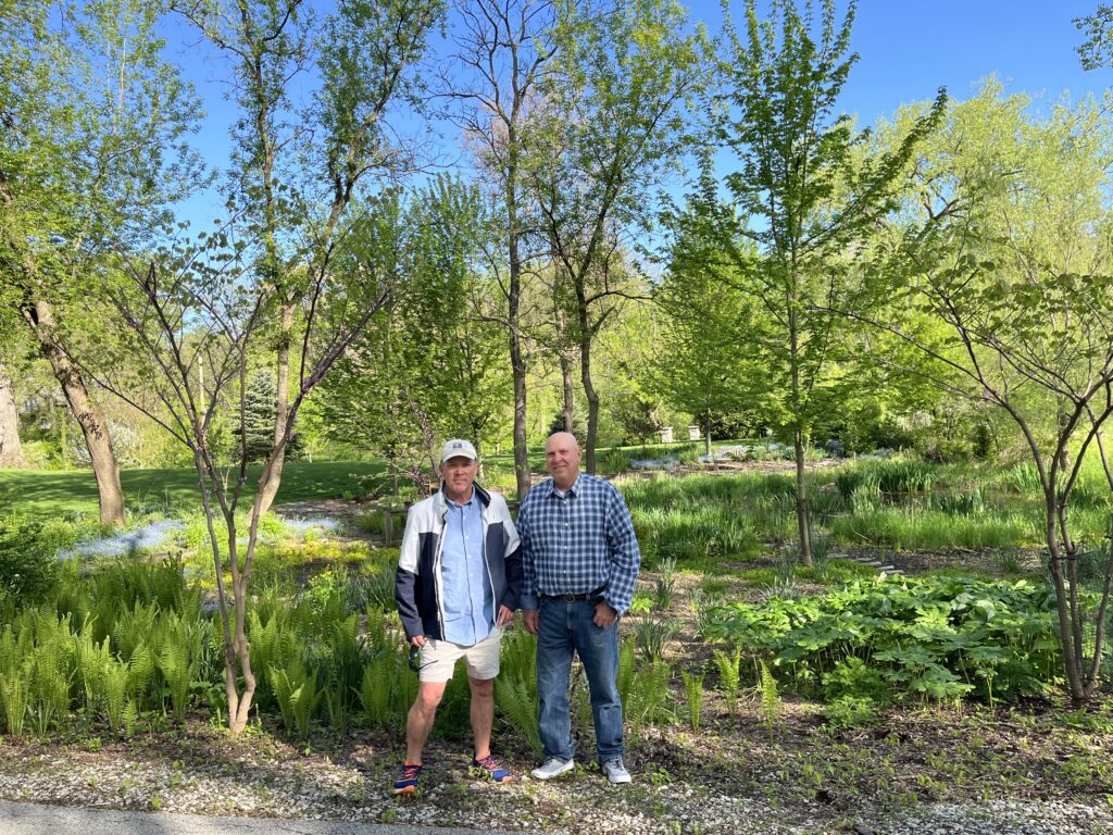 Terrace Design Construction Founders Keith and Jeff Kupczyk standing in front of landscaping.